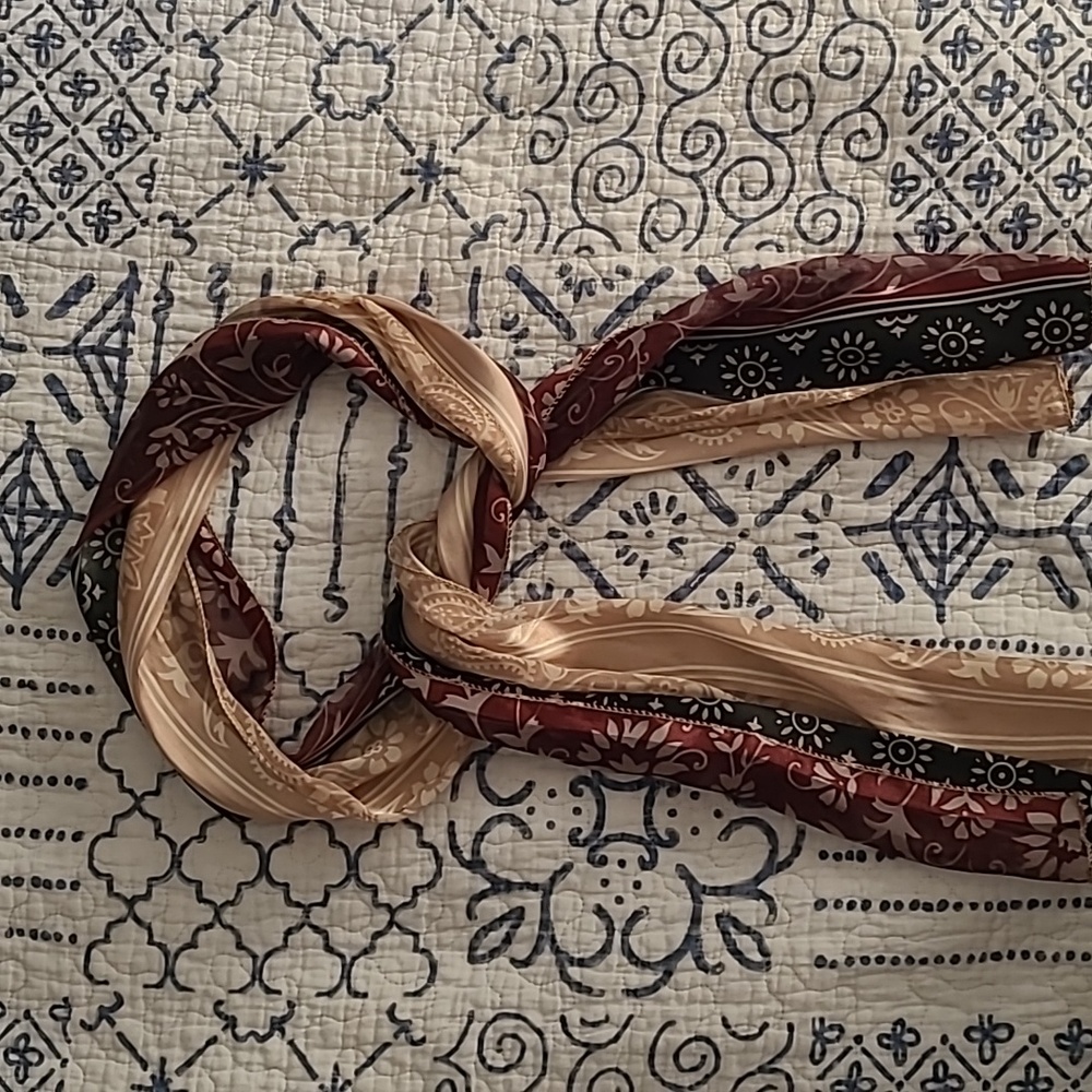 Beautiful scarf. 60x10 tan, black, maroon